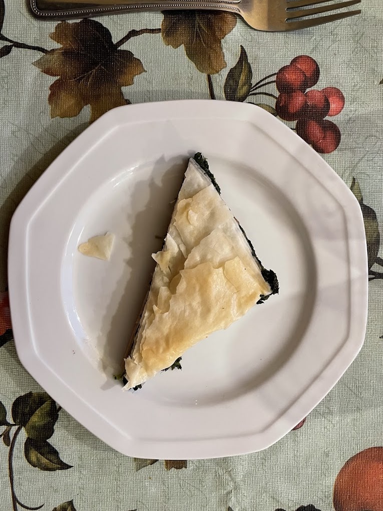 Spinach pie in phyllo pastry on a white plate